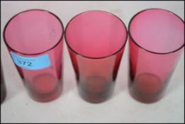 A set of 6 Victorian Cranberry glass beakers / shots. Polished out pontil marks with conical form to