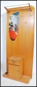 A retro 1960's teak wood hallstand having central