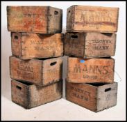 A stack of vintage mid century wooden advertising