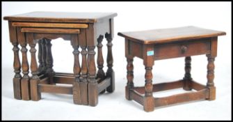 A 20th century peg jointed oak stool with a single drawer in the Jacobean manner together with an