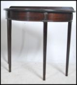 An Edwardian mahogany demi - lune console hall tab