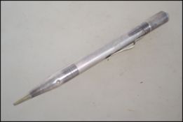 A sterling silver propelling pencil, having an eng