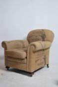 A Victorian chesterfield club armchair being upcycled with Hessian sack fabric to the barrel arms