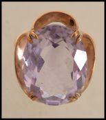 A vintage  hallmarked 9ct gold and amethyst ring. Hallmarked for Birmingham 1975. Weight 7g. Size
