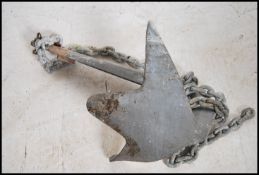 A 20th Century galvanised ship`s anchor with chain links.