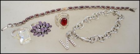 A collection of silver items to include silver belcher linked bracelet with N letter pendant.