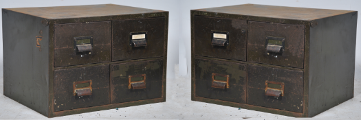 A pair of 20th century metal Industrial filing cabinet each with drawers having pull handles and