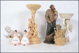 A collection of ceramic figurines to include cheru