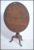 A Georgian 18th century oak birdcage tilt top tabl