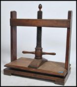A large fruitwood book press by T Bradford & Co,Fl