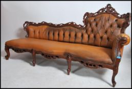 A good Rococo revival walnut and tan leather uphlo