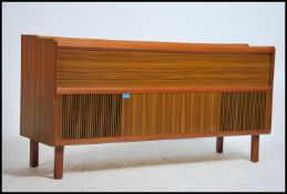 A 1970's retro teak wood gramaphone hi-fi cabinet