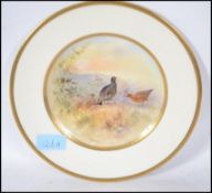 A 20th century Royal Doulton China cabinet plate decorated with a Grouse in a natural setting signed