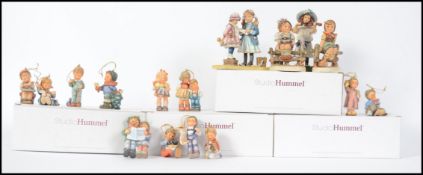 A collection of Studio Hummel figurines - Christma