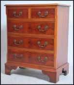 A regency style yew wood bachelors chest of drawer