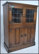 A mid century Old Charm / Jaycee style leaded glass drinks cabinet. Twin leaded glass door display