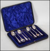 A silver hallmarked teaspoon and sugar nips set co
