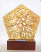 A modern 20th century  decorative wall hanging art sculpture of a recurring pattern with a gilt