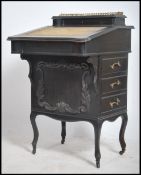 A Victorian ebonised aesthetic movement davenport