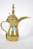 An Islamic turkiks teapot brass Dallah teapot coffee pot having tall thin spout with handle and