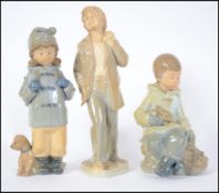 A group of three Nao 20th century ceramic figures