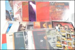 A collection of vinyl long play records together with some 12