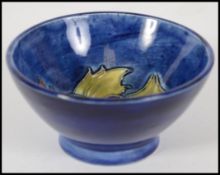 A Moorcroft bowl of small proportions in the Pansy