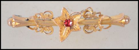 A ladies 9ct gold 375 marked ivy leaf brooch with inset decorative stone to the centre