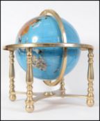 A 20th century hard stone and brass desk terrestrial globe, inlaid with various specimens