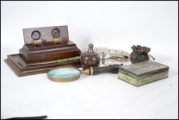 A 20th century desk top magnifying glass together