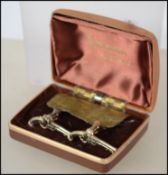 A pair of unusual gentlemans gilt and white metal