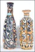 Two vintage 20th century studio pottery clay vases both having a striking hand painted finish, no