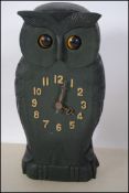 A Black Forest style clock in the form of an owl with articulating eyes. Measures 24cms.