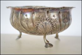 An unusual Edwardian silver hallmarked 3 footed Irish bowl Raised on hoof feet with ribbed