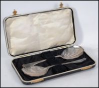 A pair of silver hallmarked salad / serving spoons