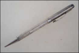 A sterling silver hallmarked propelling pencil, be