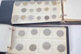 A good coin collection held within two albums to include various pre and post decimal coins,