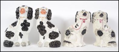 Two pairs of good black and white Staffordshire po