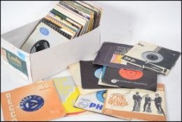A collection of assorted vintage 1970's / 1980's (and other era) 45rpm records and singles.