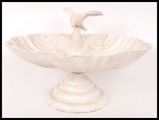 A vintage style 20th century cast iron white bird bath. Measures approx 15cms tall.