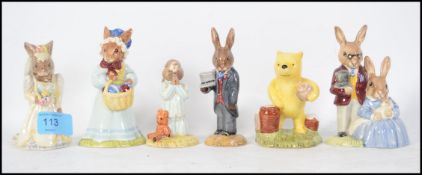 A collection of Royal Doulton Bunnykins and similar to include Groom Bunnykins DB102, Pooh
