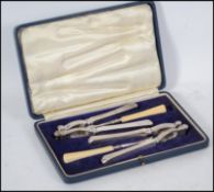 A good cased early 20th century Walker & Hall nutc