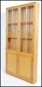 20th Century thin oak display cabinet comprising of 2 glazed doors above a cupboard. Village
