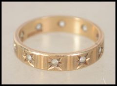 A vintage hallmarked 9ct gold eternity ring. Hallmarked for Birmingham . Weight 2.4g. Size N.