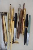A collection of vintage pens and pencils to include Platignum, cross, vintage white metal pencil and