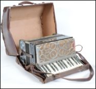 A vintage Italian Casali Verona piano accordion being twin octave with mother of pearl inlay being