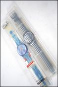 A pair of cased unused collectable Swatch watches