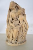 An 18th / 19th century soft stone carving of a mother reading to her daughter, both dressed in