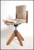 A 1920's Industrial oak clerks swivel office chair