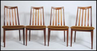 A set of four retro G - Plan teak dining chairs ha